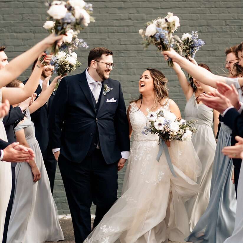 Wedding party posing for photos for a spring wedding at Mercantile Hall in Burlington, WI.