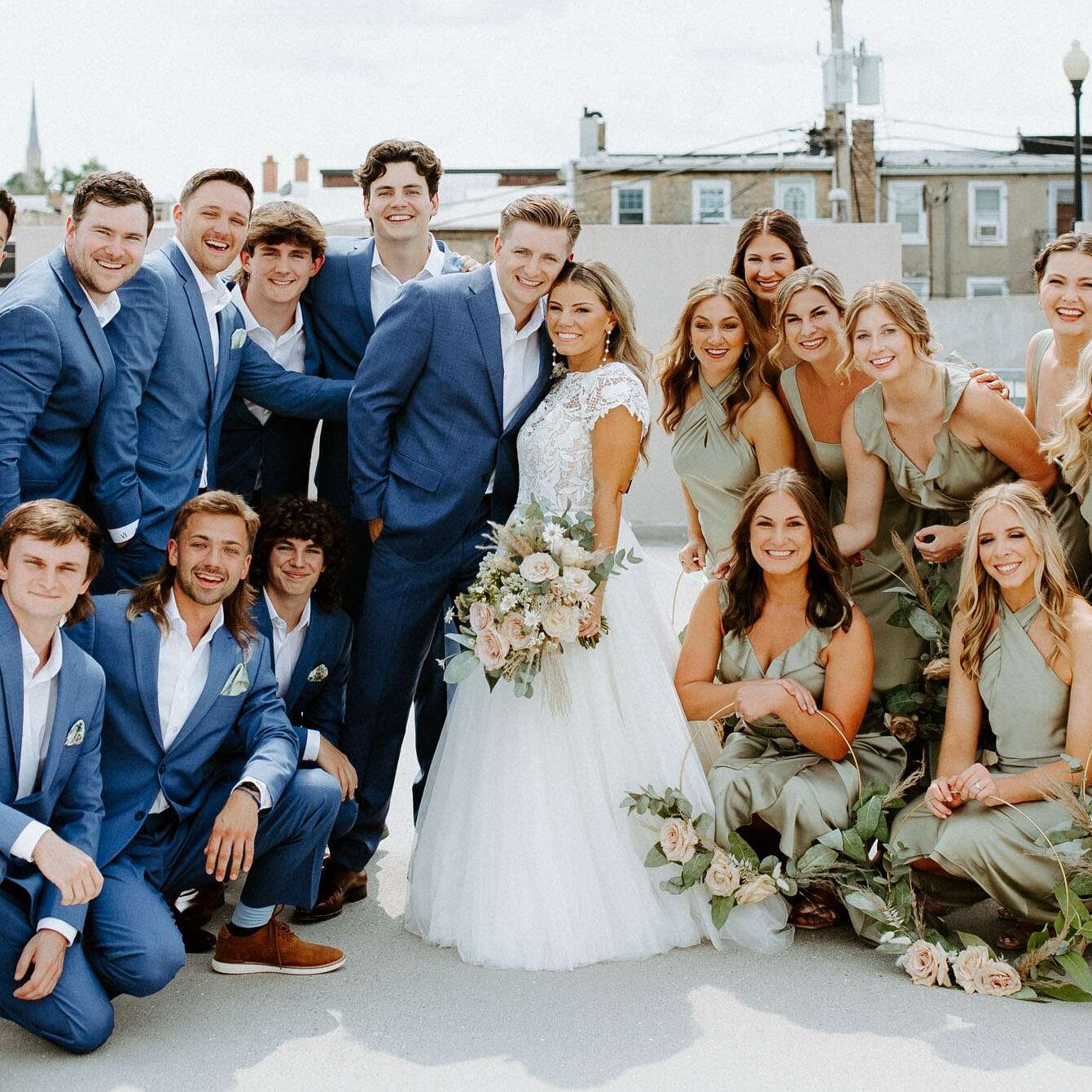 Wedding party poses on the roof of the parking garage in Burlington, WI.