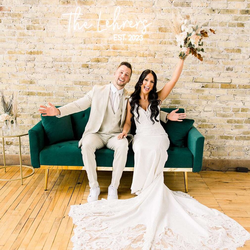 Newlyweds pose in the front room at Mercantile Hall.